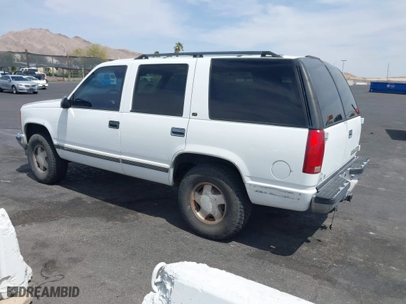 1997 Chevrolet Tahoe with VIN 1GNEK13R6VJ443195, listed as a IAAI auction lot 42000733 with 202,106 mi miles. Bid and sale history available at carsss.com. Image 3.