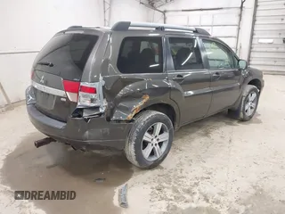 2010 Mitsubishi Endeavor SE z VIN 4A4JN3AS4AE011216, wystawiony jako IAAI lot #42048644 z przebiegiem 176 664 mil mil oraz . Historia ofert i sprzedaży dostępna na DreamBid. Obrazek 4.