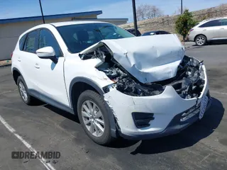 2016 Mazda CX-5 Sport with VIN JM3KE2BY9G0825285, listed as a IAAI auction lot 41841833 with 96,915 mi miles. Bid and sale history available at carsss.com. Image 1.