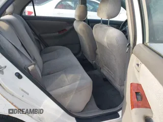 2004 Toyota Corolla CE with VIN JTDBR32E042025208, listed as a IAAI auction lot 41934485 with 299,999 mi miles. Bid and sale history available at carsss.com. Image 8.