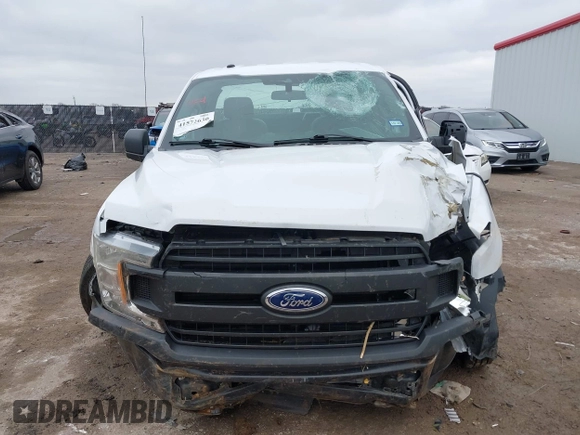 2019 Ford F-150 XL with VIN 1FTMF1CB3KKE16540, listed as a IAAI auction lot 41572630 with 73,954 mi miles and . Bid and sale history available at DreamBid. Image 12.