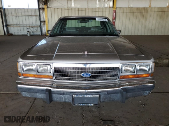 1990 Ford Crown Victoria z VIN 2FACP73F9LX166174, wystawiony jako Copart lot #76043234 z przebiegiem 52 545 mil mil oraz Szkoda całkowita • Salvage title. Historia ofert i sprzedaży dostępna na DreamBid. Obrazek 5.