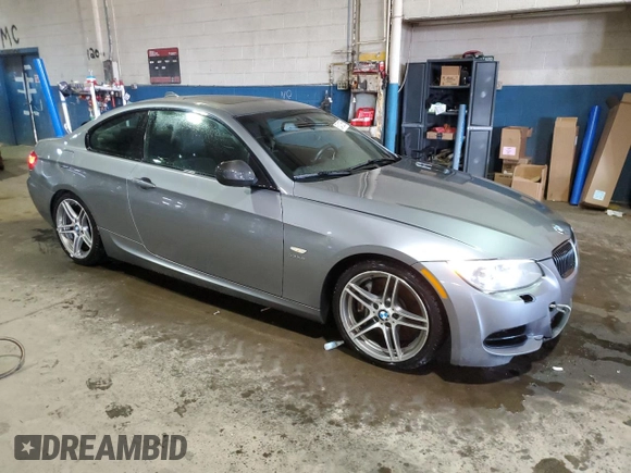 2011 BMW 3 Series 335is with VIN WBAKG1C56BE599457, listed as a Copart auction lot 52412655 with 134,497 mi miles and Clean title. Bid and sale history available at DreamBid. Image 4.