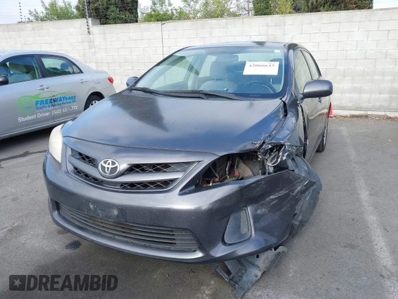 2011 Toyota Corolla L with VIN JTDBU4EE7B9162022, listed as a IAAI auction lot 42066643 with 124,384 mi miles. Bid and sale history available at carsss.com. Image 13.
