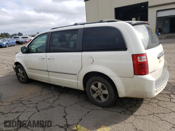 2010 Dodge Grand Caravan SXT with VIN 2D4RN5D11AR331804, listed as a Copart auction lot 73735873 with 183,923 mi miles and Salvage Title. Bid and sale history available at DreamBid. Image 2.