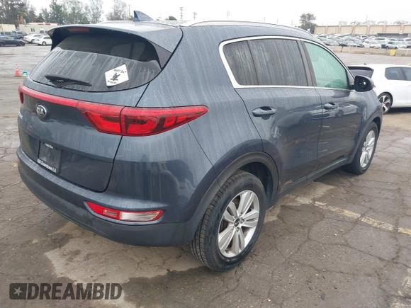 2018 Kia Sportage LX with VIN KNDPM3ACXJ7413596, listed as a IAAI auction lot 41871847 with 72,959 mi miles and . Bid and sale history available at carsss.com. Image 4.