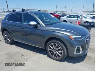 2022 Audi SQ5 Premium Plus z VIN WA1B4AFY0N2130849, wystawiony jako IAAI lot #42381073 z przebiegiem 50 888 mil mil oraz . Historia ofert i sprzedaży dostępna na DreamBid. Obrazek 1.