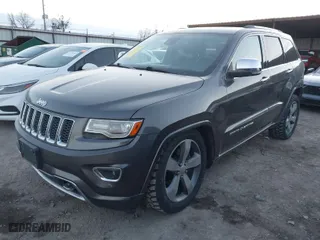 2014 Jeep Grand Cherokee Overland with VIN 1C4RJFCT8EC380899, listed as a IAAI auction lot 41372034 with 140,413 mi miles. Bid and sale history available at carsss.com. Image 2.