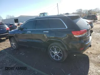 2019 Jeep Grand Cherokee Overland with VIN 1C4RJFCG9KC569575, listed as a Copart auction lot 48952875 with 87,053 mi miles and Salvage Title. Bid and sale history available at carsss.com. Image 2.