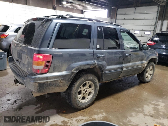 2001 Jeep Grand Cherokee Limited with VIN 1J4GW58N01C664996, listed as a Copart auction lot 58339825 with 288,153 mi miles and Salvage title. Bid and sale history available at DreamBid. Image 3.