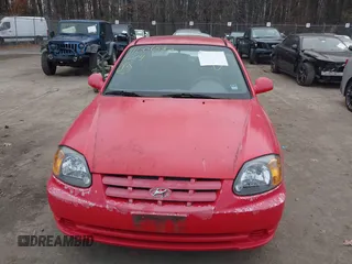 2005 Hyundai Accent GLS with VIN KMHCG45CX5U614083, listed as a IAAI auction lot 41006582 with 72,516 mi miles. Bid and sale history available at carsss.com. Image 12.