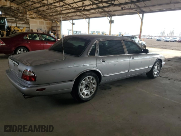 2000 Jaguar XJ with VIN SAJDA25B8YMF04079, listed as a Copart auction lot 50592595 with 131,647 mi miles and Salvage title. Bid and sale history available at DreamBid. Image 3.