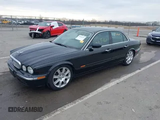2004 Jaguar XJ with VIN SAJWA71C14SG20122, listed as a IAAI auction lot 41685767 with 113,392 mi miles. Bid and sale history available at carsss.com. Image 18.
