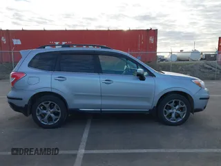 2016 Subaru Forester 2.5i Touring with VIN JF2SJAXC7GH455601, listed as a IAAI auction lot 41876613 with 133,976 mi miles. Bid and sale history available at carsss.com. Image 14.