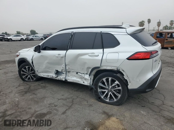 2022 Toyota Corolla Cross XLE with VIN 7MUDAAAG6NV014706, listed as a Copart auction lot 52456065 with 31,041 mi miles and Salvage title. Bid and sale history available at DreamBid. Image 2.
