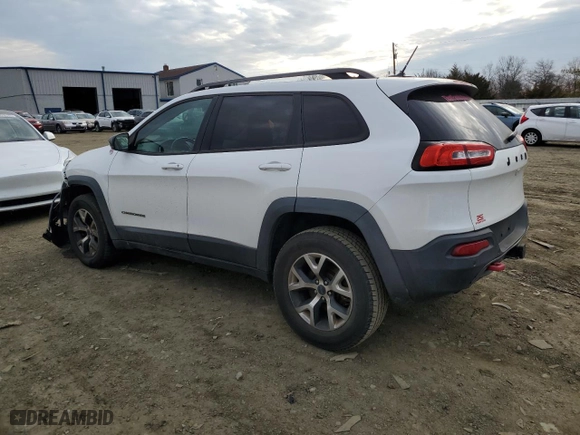 2015 Jeep Cherokee Trailhawk with VIN 1C4PJMBB1FW528766, listed as a Copart auction lot 46879355 with 248,676 mi miles and Salvage Title. Bid and sale history available at carsss.com. Image 2.