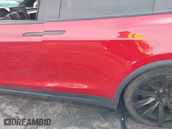 2022 Tesla Model X Plaid with VIN 7SAXCBE60NF330246, listed as a IAAI auction lot 41477394 with 51,612 mi miles and . Bid and sale history available at DreamBid. Image 20.