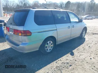 2004 Honda Odyssey EX-L with VIN 5FNRL18974B057715, listed as a IAAI auction lot 41762518 with 193,626 mi miles and . Bid and sale history available at DreamBid. Image 4.