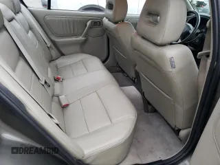 2000 Infiniti G20 Luxury z VIN JNKCP11A5YT303404, wystawiony jako Copart lot #82801234 z przebiegiem 178 185 mil mil oraz Tytuł czysty. Historia ofert i sprzedaży dostępna na DreamBid. Obrazek 10.