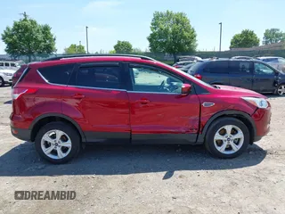 2016 Ford Escape SE z VIN 1FMCU9GX1GUC04815, wystawiony jako IAAI lot #42235499 z przebiegiem 84 713 mil mil oraz . Historia ofert i sprzedaży dostępna na DreamBid. Obrazek 13.