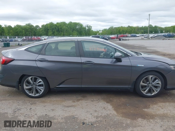 2018 Honda Clarity Touring z VIN JHMZC5F3XJC001054, wystawiony jako IAAI lot #42292688 z przebiegiem 60 780 mil mil oraz . Historia ofert i sprzedaży dostępna na DreamBid. Obrazek 13.