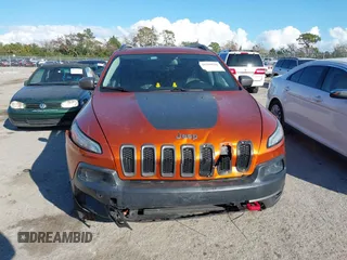 2014 Jeep Cherokee Trailhawk with VIN 1C4PJMBS4EW254879, listed as a IAAI auction lot 41550356 with 101,077 mi miles. Bid and sale history available at carsss.com. Image 13.