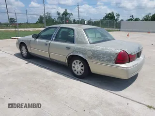 2004 Mercury Grand Marquis LS Premium z VIN 2MEFM75WX4X607033, wystawiony jako IAAI lot #42332543 z przebiegiem 179 297 mil mil oraz . Historia ofert i sprzedaży dostępna na DreamBid. Obrazek 3.