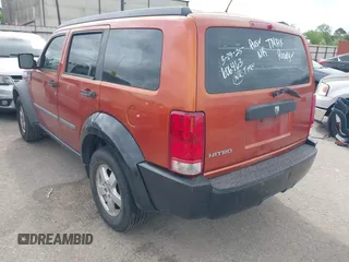 2007 Dodge Nitro SXT with VIN 1D8GT28K07W606463, listed as a IAAI auction lot 41927859 with 194,558 mi miles. Bid and sale history available at carsss.com. Image 3.