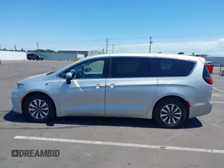 2023 Chrysler Pacifica Hybrid Touring L with VIN 2C4RC1L75PR614460, listed as a IAAI auction lot 42628545 with 68,668 mi miles and . Bid and sale history available at DreamBid. Image 14.