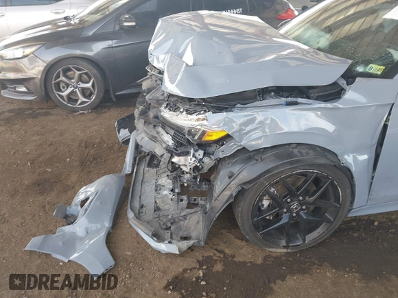 2022 Honda Civic Si with VIN 2HGFE1E58NH473302, listed as a IAAI auction lot 41473435 with 34,685 mi miles and . Bid and sale history available at DreamBid. Image 6.
