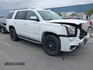 2019 GMC Yukon SLT with VIN 1GKS2BKC3KR160060, listed as a IAAI auction lot 42042122 with 124,733 mi miles. Bid and sale history available at carsss.com. Image 1.