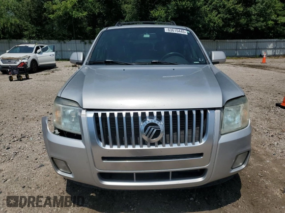 2009 Mercury Mariner Premier z VIN 4M2CU87G19KJ14006, wystawiony jako Copart lot #63615445 z przebiegiem 216 941 mil mil oraz Szkoda całkowita • Salvage title. Historia ofert i sprzedaży dostępna na DreamBid. Obrazek 5.