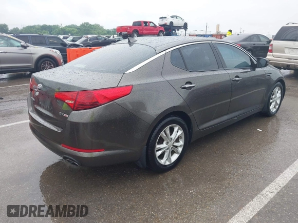 2013 Kia Optima EX z VIN 5XXGN4A79DG181719, wystawiony jako IAAI lot #42372478 z przebiegiem 166 410 mil mil oraz . Historia ofert i sprzedaży dostępna na DreamBid. Obrazek 4.