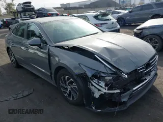 2022 Hyundai Sonata Hybrid Blue with VIN KMHL24JJ5NA037502, listed as a IAAI auction lot 40975379 with 69,018 mi miles. Bid and sale history available at carsss.com. Image 1.