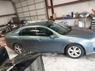 2012 Ford Fusion SE z VIN 3FAHP0HA8CR298495, wystawiony jako IAAI lot #42245859 z przebiegiem 192 979 mil mil oraz . Historia ofert i sprzedaży dostępna na DreamBid. Obrazek 13.