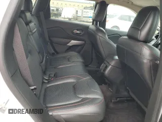 2017 Jeep Cherokee Trailhawk z VIN 1C4PJMBS3HW569628, wystawiony jako Copart lot #57105855 z przebiegiem 127 637 mil mil oraz Szkoda całkowita • Salvage title. Historia ofert i sprzedaży dostępna na DreamBid. Obrazek 11.