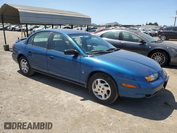 2000 Saturn SL with VIN 1G8ZK5271YZ184701, listed as a Copart auction lot 61598135 with 123,309 mi miles and Salvage title. Bid and sale history available at DreamBid. Image 4.