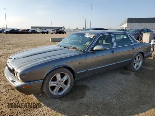2002 Jaguar XJ with VIN SAJFA12C72LF47096, listed as a Copart auction lot 65597025 with 287,105 mi miles and Clean title. Bid and sale history available at DreamBid. Image 1.