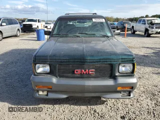1993 GMC Jimmy z VIN 1GDCT18Z9P0810178, wystawiony jako Copart lot #79442614 z przebiegiem 19 514 mil mil oraz Szkoda całkowita • Salvage title. Historia ofert i sprzedaży dostępna na DreamBid. Obrazek 5.