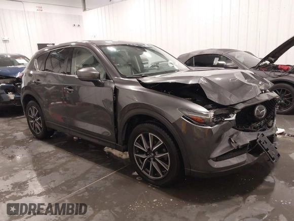 2017 Mazda CX-5 Grand Touring with VIN JM3KFADLXH0151593, listed as a IAAI auction lot 41823378 with 149,299 mi miles. Bid and sale history available at carsss.com. Image 1.