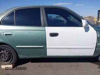2005 Hyundai Accent GLS with VIN KMHCG45C95U620716, listed as a IAAI auction lot 41740573 with 187,971 mi miles. Bid and sale history available at carsss.com. Image 14.