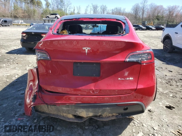 2021 Tesla Model Y Long Range with VIN 5YJYGAEE4MF260627, listed as a Copart auction lot 49091655 with 67,850 mi miles and Salvage Title. Bid and sale history available at DreamBid. Image 6.