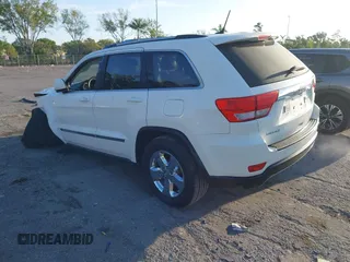 2011 Jeep Grand Cherokee Laredo with VIN 1J4RS4GGXBC739433, listed as a IAAI auction lot 41794031 with 174,672 mi miles and . Bid and sale history available at DreamBid. Image 3.