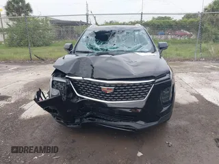 2024 Cadillac XT4 AWD Premium Luxury с VIN 1GYFZDR44RF147956, выставлен на аукционе IAAI как лот 42434595 с пробегом 26 328 миль миль и . История ставок и продаж доступна на DreamBid. Изображение 6.