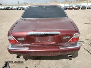 1998 Jaguar XJ Vanden Plas with VIN SAJKX6245WC830912, listed as a Copart auction lot 49717285 with 127,509 mi miles and Salvage Title. Bid and sale history available at DreamBid. Image 6.