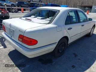 1999 Mercedes-Benz E-Class with VIN WDBJF82H4XX025925, listed as a IAAI auction lot 41839398 with 238,583 mi miles. Bid and sale history available at carsss.com. Image 4.