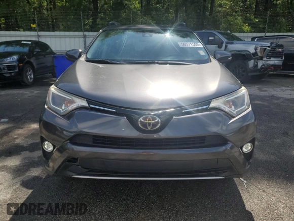 2018 Toyota RAV4 XLE with VIN JTMWFREV5JJ747297, listed as a Copart auction lot 56371505 with 215,598 mi miles and Clean Title. Bid and sale history available at DreamBid. Image 6.