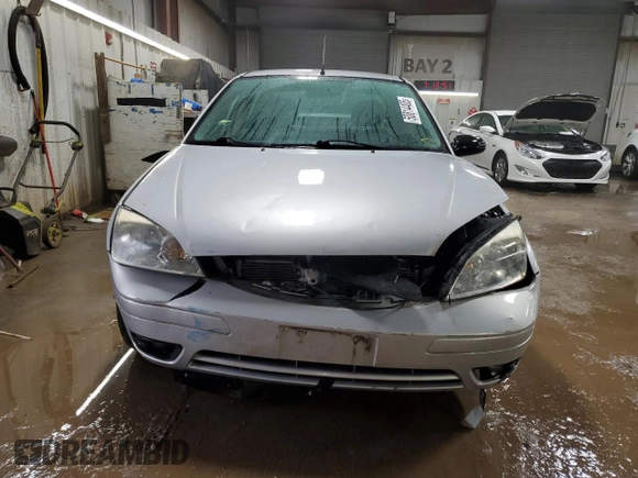 2007 Ford Focus S z VIN 1FAHP34N37W262789, wystawiony jako Copart lot #50814405 z przebiegiem 56 604 mil mil oraz Szkoda całkowita • Salvage title. Historia ofert i sprzedaży dostępna na DreamBid. Obrazek 5.