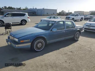 1988 Cadillac Seville z VIN 1G6KS5152JU809989, wystawiony jako Copart lot #51385205 z przebiegiem 40 217 mil mil oraz Tytuł czysty. Historia ofert i sprzedaży dostępna na DreamBid. Obrazek 1.