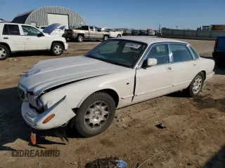 2001 Jaguar XJ with VIN SAJDA14CX1LF29825, listed as a Copart auction lot 42064715 with 127,389 mi miles and Salvage Title. Bid and sale history available at carsss.com. Image 1.